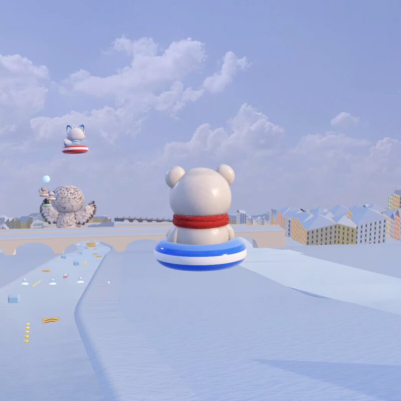 The polar bear cub sliding toward a stone bridge in Prague with a giant owl beyond